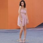 Model in pastel pink mini dress for women