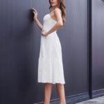 Sleek white midi sundress on model