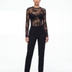 Straight front formal portrait of elegant long sleeve black lace corset top